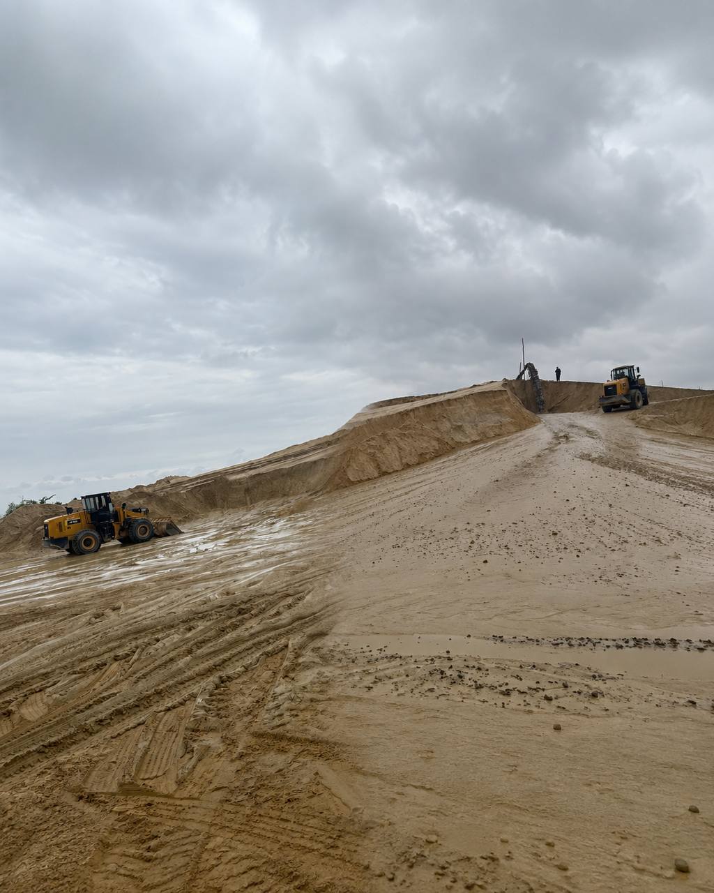 Excavator working a stone quarry mining site